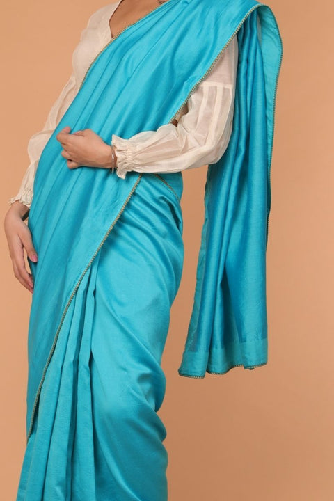 Luxury Handcrafted Chanderi Sari in Aqua with Balloon Sleeve Chanderi Blouse in Off-White | Vinusto