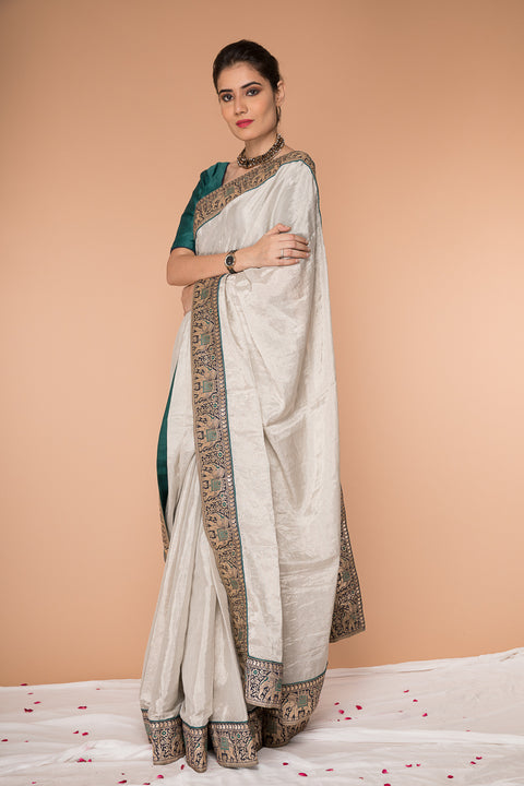Buy Handcrafted Silver & Teal Zari Saree – Elegant & Traditional

